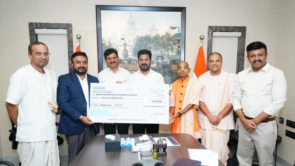 Hare Krishna Movement Charitable Foundation receives a Rs 4 crore cheque during a formal meeting